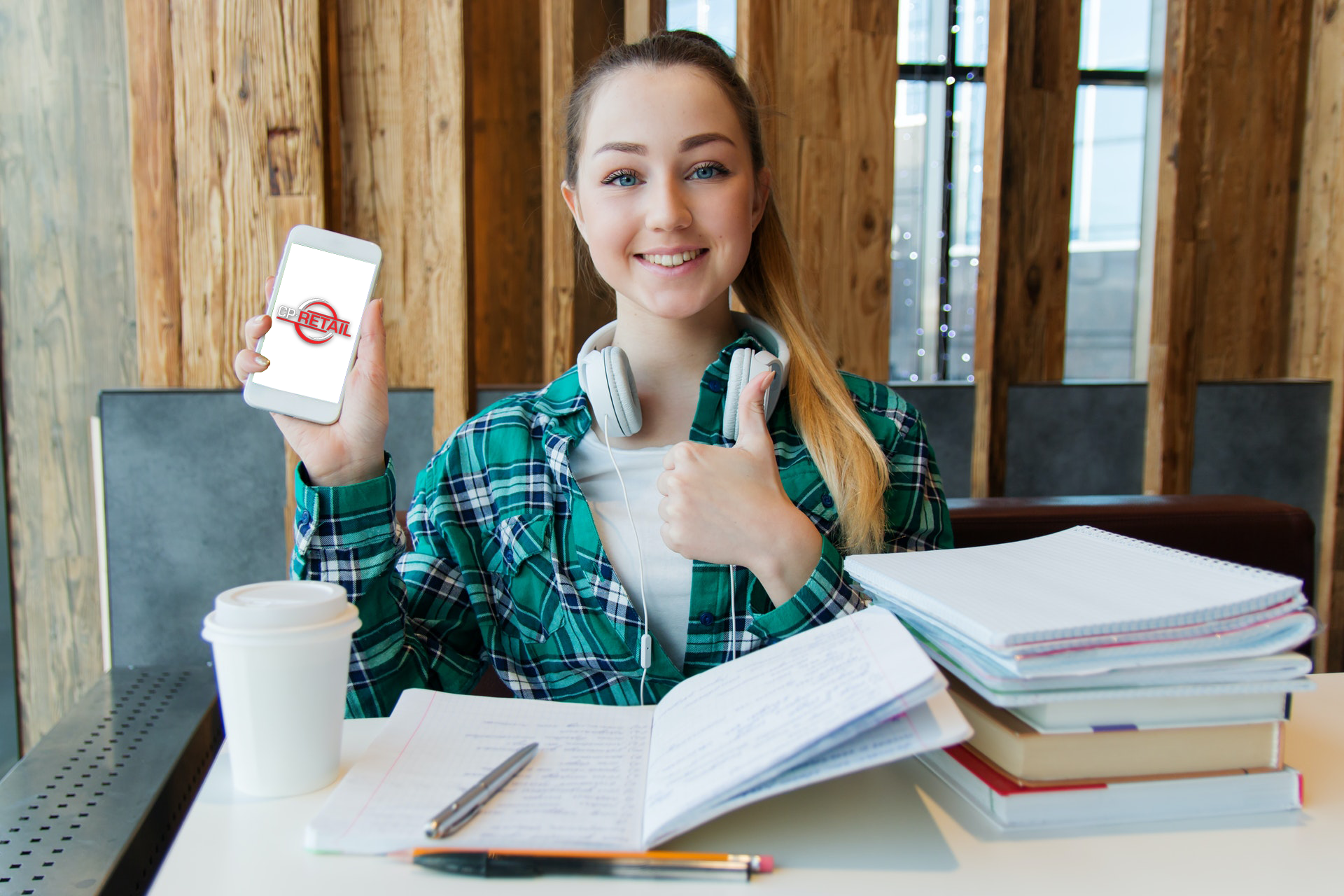 woman in school store with phone retail logo