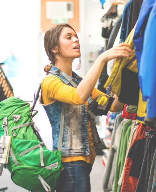 Counterpoint Sporting Goods Customer Woman Holding Clothing Goods